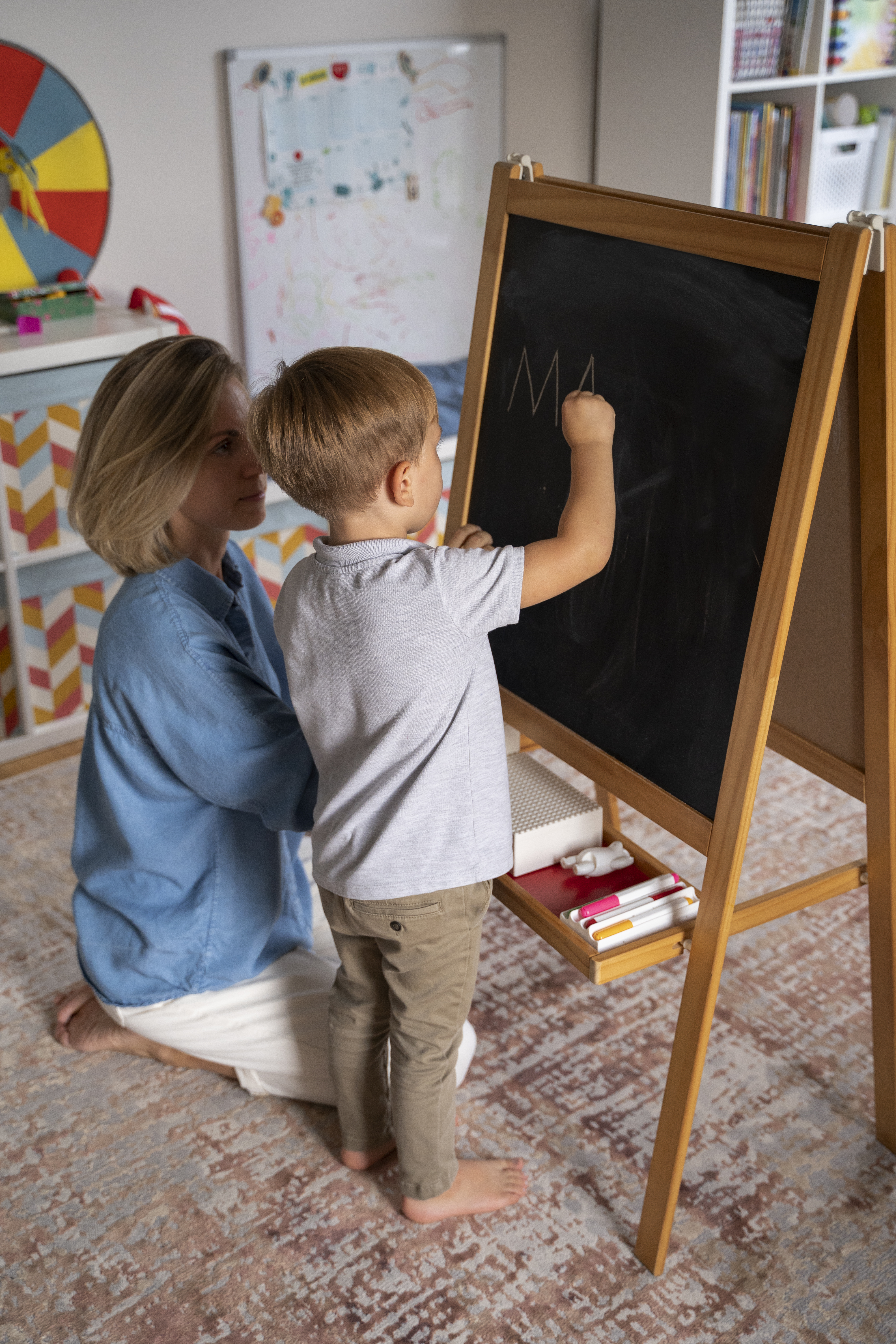 A behavioral therapist learning through ABA with a child with autism